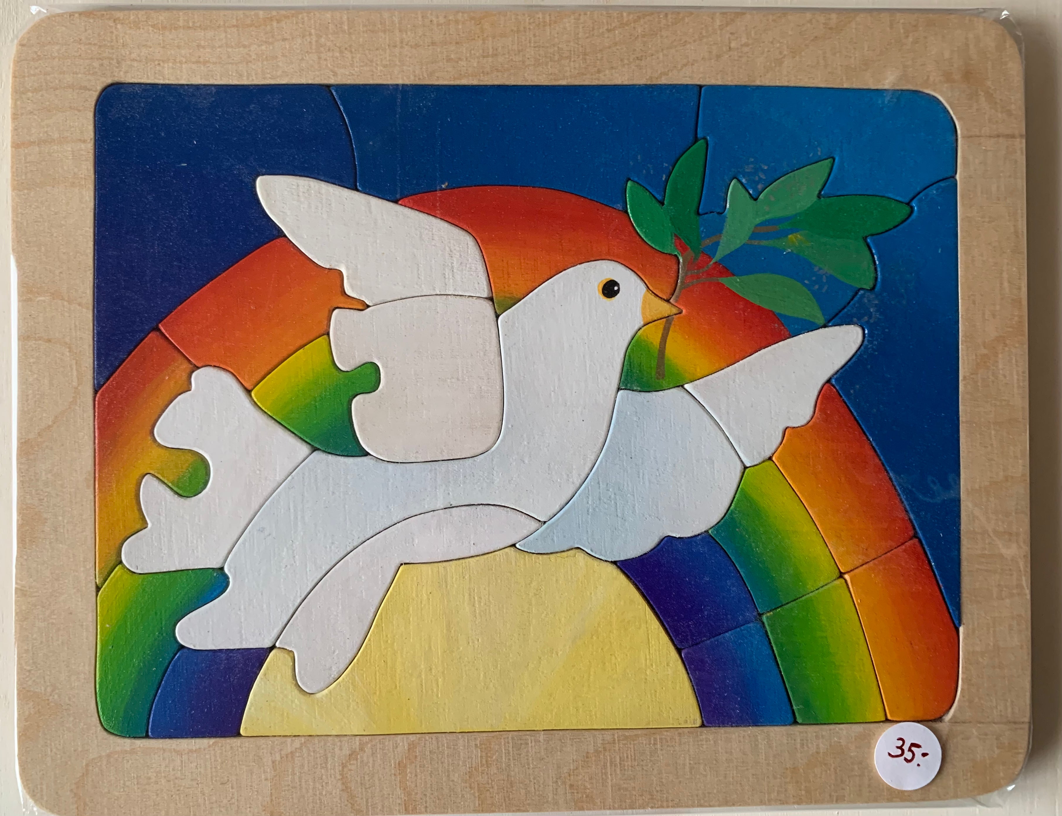 Taube mit Friedenszweig und Regenbogen